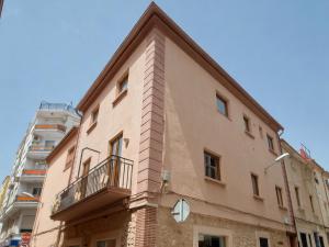a building with a balcony on the side of it at El Passeig Rural in Castalla