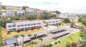 an aerial view of a large building with palm trees at #7 Illovo Views in Kingsborough