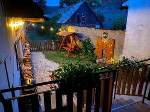 a view of a garden from a balcony at night at Apartmán Arkona in Slovenská ľupča