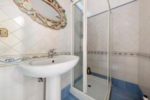 a bathroom with a sink and a shower at Villa Charme Lipari in Lipari
