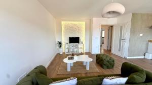 a living room with a couch and a table at Nikola apartman in Arilje