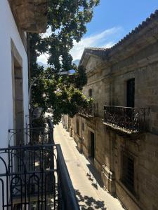 a view of a street from a balcony of a building at Casa Centro in Hervás