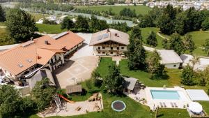 an aerial view of a house with a swimming pool at Ferienparadies Taxen in Sankt Veit im Pongau