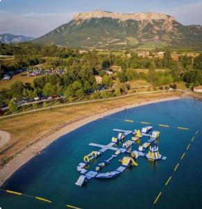 an aerial view of a bunch of boats in the water at les Trois Cœurs in Mison