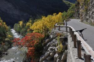 a bike on a bridge over a mountain road at les Trois Cœurs in Mison +2 photos