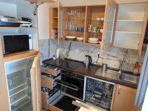 a small kitchen with a sink and a stove at 386 Apartman in Písek