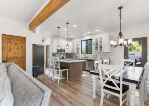 a kitchen and living room with a table and chairs at The Farmhouse in Darby