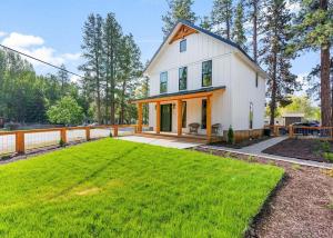 a house with a large lawn in front of it at The Farmhouse in Darby