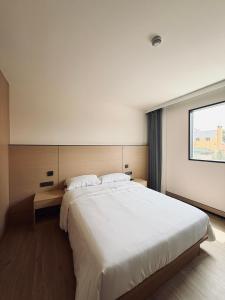 a bedroom with a large white bed and a window at Hotel Nueva Europa Valencia in Valencia +57 photos