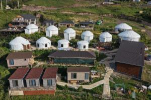 an aerial view of a farm with white domes at Gulbubu Guest house in Kochkorka