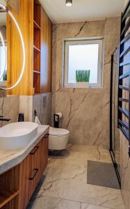 a bathroom with a sink and a window at Oaza Brzozowa in Stradomia Wierzchnia +57 photos