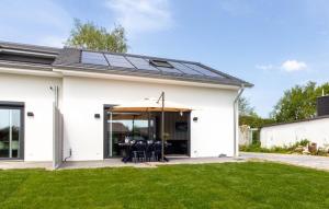a house with solar panels on the roof at Ferienhaus Eastside - Niendorf in Häven