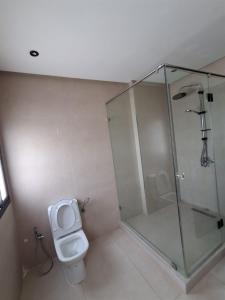 a bathroom with a shower and a toilet at Villa Anfa in Casablanca +26 photos