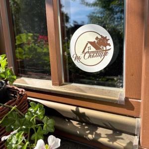 a sticker on the window of a house at Chalúpka Polom in Hnúšťa