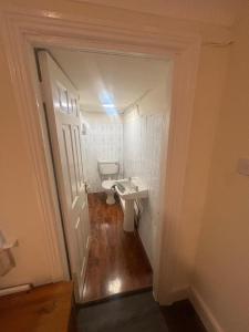 a small bathroom with a sink and a toilet at Newbridge house in Newbridge