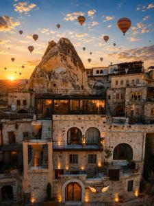 a group of hot air balloons flying in the sky at Angel View Suites in Göreme