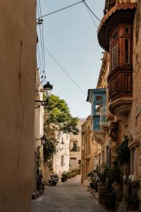 an alley in an old town with buildings at Casa Radiant in Rabat