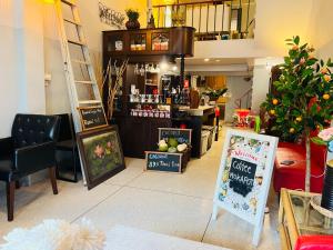 a room with a store with a counter and a bar at Baan Bangrak Home in Bang Rak