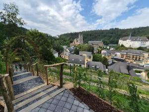 a set of stairs leading up to a town at Hotel du Commerce - Restaurant La Table de Clervaux in Clervaux