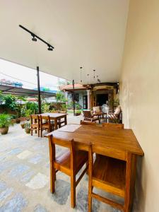 a dining room with a table and chairs at Hotel Anaya in Pokhara