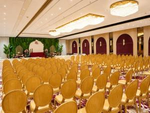a large room with rows of chairs in it at LUXURIA INN By CHANDAN in Junagadh