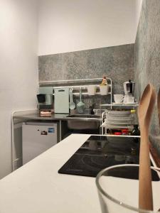a kitchen with a sink and a counter top at Ocean front La Maresia Holiday 2 Apartments in Taganana