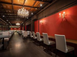a dining room with a long table and white chairs at Okudogo Ichiyunomori in Matsuyama +264 photos
