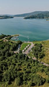 an aerial view of a lake with a group of boats at Aqua Glamp in Jaszczurowa