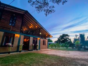 a building with lights on the side of it at Senaro Villa in Sigiriya