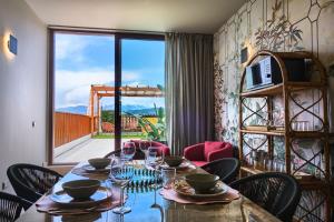 a table with wine glasses and a view of a balcony at Maison Bra 10 in Verona