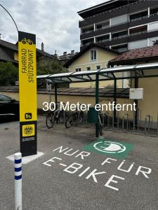 a sign that says meter enrichment not built in a parking lot at Kristall, Doppelzimmer mit Balkon in Toplage, Zentrum in Bad Ischl
