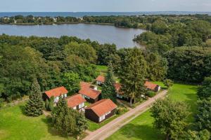 an aerial view of a house with a lake at Ferienanlage Bansin Seepferdchen 5 in Bansin