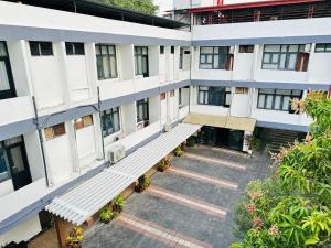 an overhead view of an apartment building with benches at Subhas Tourist Hotel in Jaffna