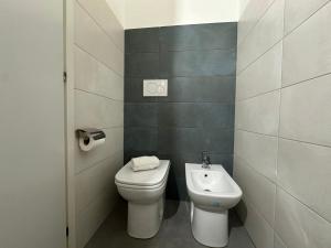 a bathroom with a toilet and a sink at La Casa di Orlando in Catania +40 photos