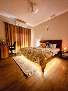 a bedroom with a bed and a window and a rug at Romantic Sky Studio with Pool by The Nook in Sohna