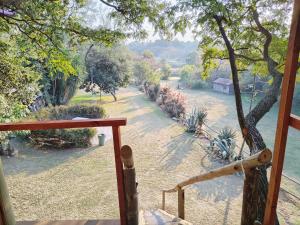 a view from the porch of a house with a view of a river at Tree house Living in Roodepoort +2 photos