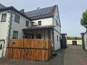 a house with solar panels on top of it at Unseburger Brauhaus - FW7 in Unseburg