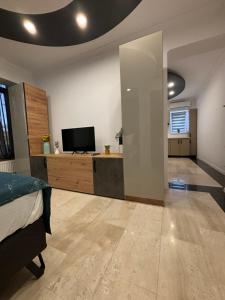 Un televizor și/sau centru de divertisment la Afrodita Residence