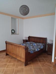 a bedroom with a bed in a room at Le Picasso in La Chaise-Dieu