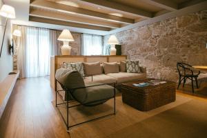 a living room with a couch and a table at Torel Saboaria in Porto