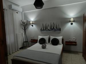 a bedroom with a bed with sails on the wall at Villa Evgenia(Leonidas) in Ierissos