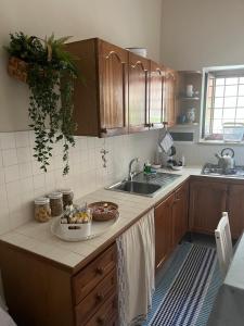 a kitchen with a sink and a counter top at Da zio Totò in Scilla