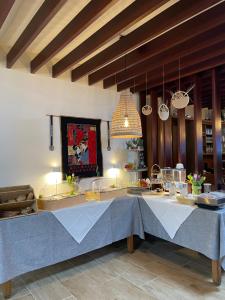 a kitchen with a large blue table in a room at Vina am Ring in Mannebach