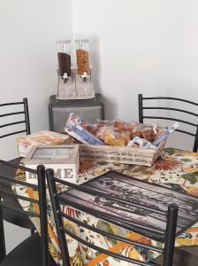 a table with a bunch of food on it at Dimora Collina 3 in Sannicola +9 photos