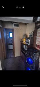 a kitchen with a stove and a microwave at Chill & Woods in Štrucljevo