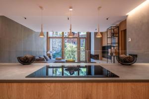a living room with a glass table in the middle of a room at Isard Penthouse & Spa in El Tarter