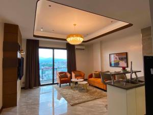 a living room with a couch and a table at High Class 1BR at One Euphoria in Angeles