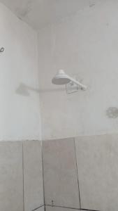 a light on the ceiling of a room at SUITE CENTRAL BECO DAS FLORES in Jericoacoara +22 photos
