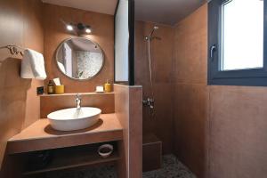 a bathroom with a sink and a mirror and a shower at Liostasi Villas by Olga in Leptokarya +34 photos