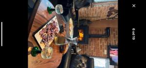 an overhead view of a living room with a wall with bottles at Chill & Woods in Štrucljevo +9 photos